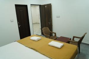 Postel nebo postele na pokoji v ubytování Jayshree Cottages