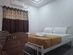 Postel nebo postele na pokoji v ubytování Jayshree Cottages