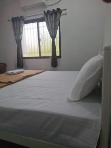 Postel nebo postele na pokoji v ubytování Jayshree Cottages
