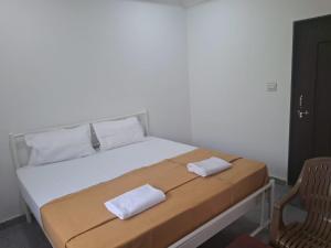 Postel nebo postele na pokoji v ubytování Jayshree Cottages