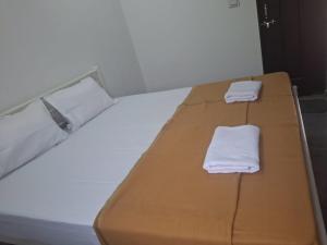 Postel nebo postele na pokoji v ubytování Jayshree Cottages