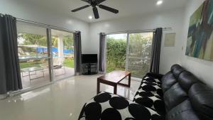 a living room with a couch and a table at Belle Homes in Panglao