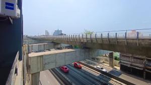 an overhead view of a bridge with cars on a highway at Chubby 9 Standard room in Ban Bang Phlat