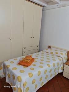 Postel nebo postele na pokoji v ubytování La Casa di Tella - Portopaglia free wifi - free parking