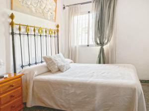 Cama ou camas em um quarto em Villa Francisca