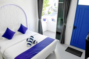 Postel nebo postele na pokoji v ubytování Santorini Maafushi Maldives