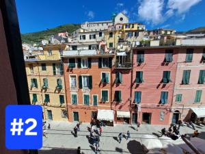 a group of people walking in front of a group of buildings at Le Stanze del Barbara in Vernazza