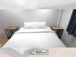 Ένα ή περισσότερα κρεβάτια σε δωμάτιο στο GO INN Phuket old Town - ภูเก็ต โอลทาวน์