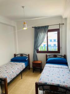 Postel nebo postele na pokoji v ubytování Blue Horizon