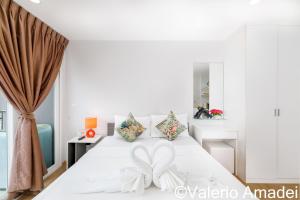 Katil atau katil-katil dalam bilik di Ozone Condotel Kata Beach by PHR +18 gambar