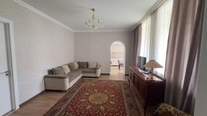 a living room with a couch and a table at Family house in Ach'khoti