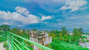 a view of a city with a mountain in the background at Villa Panderman Asri with Private Pool and Rooftop in Tlekung