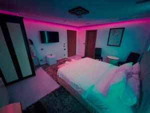Postel nebo postele na pokoji v ubytování Hotel Rosa Blu
