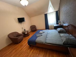 Postel nebo postele na pokoji v ubytování Отель Ренессанс