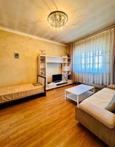 a living room with a couch and a table at City Center in Ulaanbaatar
