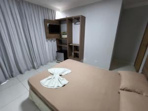 Postel nebo postele na pokoji v ubytování Hotel Vitória - Guaíra