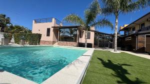 a swimming pool in front of a house at Morgana Sea in Catania