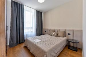 Modena Resort Spa & Wellness Zlatibor客房内的一张或多张床位
