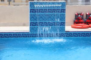Bazén v ubytování Areen Al Naeem Served Apartments nebo v jeho okolí
