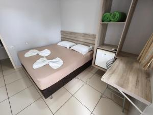Postel nebo postele na pokoji v ubytování Hotel Vitória - Guaíra