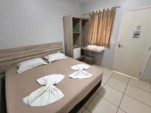 Postel nebo postele na pokoji v ubytování Hotel Vitória - Guaíra