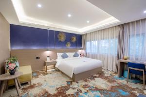 Postel nebo postele na pokoji v ubytování Cavalier Hotel Chongqing