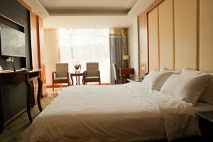 Postel nebo postele na pokoji v ubytování Cavalier Hotel Chongqing