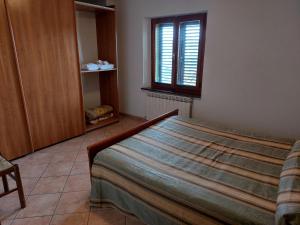Ένα ή περισσότερα κρεβάτια σε δωμάτιο στο Agriturismo Roccamaia