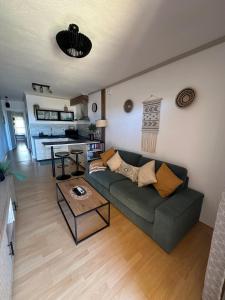 a living room with a couch and a table at Paraíso en Fuerteventura in Costa Calma