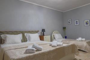 Ένα ή περισσότερα κρεβάτια σε δωμάτιο στο SeaView House Nikiti 2