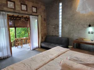 Ένα ή περισσότερα κρεβάτια σε δωμάτιο στο Ganayu Bali Villa