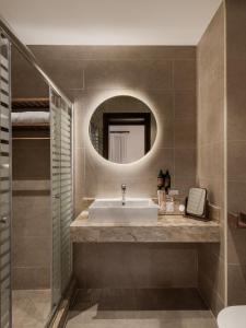 a bathroom with a sink and a mirror at MGM Wellness Retreat in Aswan