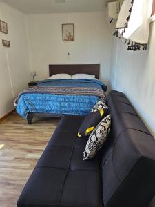Postel nebo postele na pokoji v ubytování Cabañas Hostalner