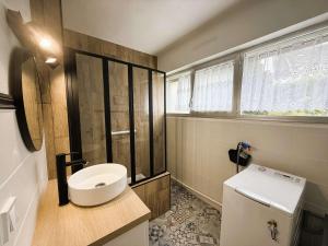 a bathroom with a sink and a toilet in it at Bénodet : Superbe T2 rénové à 100m de la plage, parking inclus - FR-1-481-90 in Bénodet +9 photos