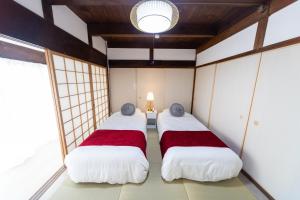 Postel nebo postele na pokoji v ubytování Miraie Yokkaichi Heizucho
