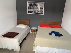 Postel nebo postele na pokoji v ubytování Aloha Beach Temporada