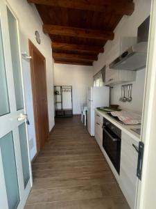 Kuchyň nebo kuchyňský kout v ubytování Tramontana + 11 fotografií