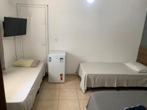 Postel nebo postele na pokoji v ubytování Aloha Beach Temporada