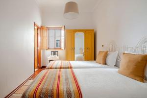 Ένα ή περισσότερα κρεβάτια σε δωμάτιο στο Casa da Ti Maria Vieira +48 φωτογραφίες