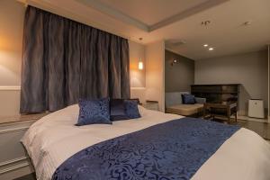 Katil atau katil-katil dalam bilik di ホテル 兆 各務原店 Hotel CHO Kakamigahara