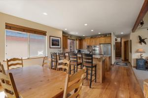 a kitchen and dining room with a wooden table and chairs at Midway 4 Bedroom 4,5 Bathroom golf course Luxury Turnberry 23 home in Midway