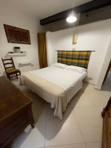 Postel nebo postele na pokoji v ubytování Dimora Volturno - Le Stanze + 7 fotografií