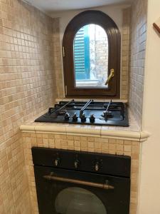 Kuchyň nebo kuchyňský kout v ubytování Dimora Volturno - Le Stanze