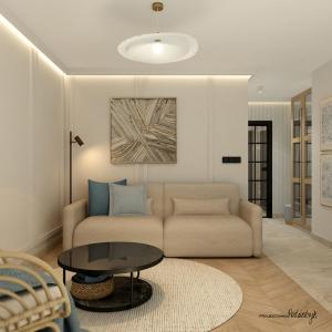 a living room with a couch and a table at Modern Gdańsk Wyspa Sobieszewska in Gdańsk