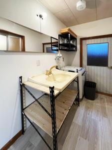 a bathroom with a sink and a toilet at 海の見える一軒家7名二ツ岩 Arun別邸 in Abashiri