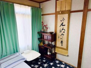 TV a/nebo společenská místnost v ubytování Shiga Biwa Lake Shanshui House