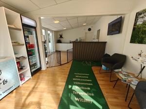 a room with a green carpet on the floor at Frederiksværk Camping & Hostel in Frederiksværk