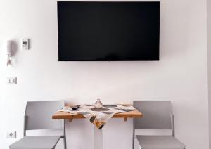 TV a/nebo společenská místnost v ubytování Hotel Vienna
