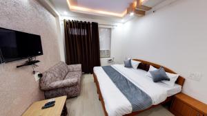 TV a/nebo společenská místnost v ubytování Hotel Eleven Elites