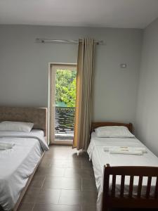 Voodi või voodid majutusasutuse Raja Hotel Fierze toas